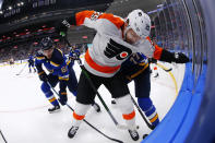 Philadelphia Flyers forward James van Riemsdyk (25) fights for control of the puck against St. Louis Blues forward Jacob De La Rose (61) of Sweden during the first period of an NHL hockey game Wednesday, Jan. 15, 2020 in St. Louis. (AP Photo/Dilip Vishwanat)