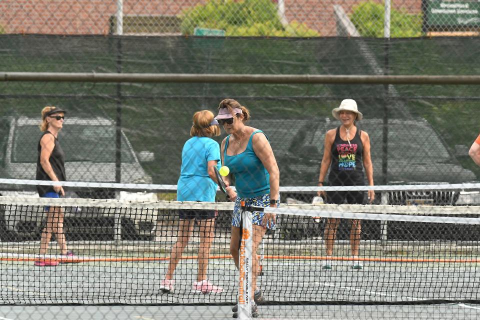 Players enjoy a game of pickleball at Greenfield Lake in Wilmington N.C. Tuesday June 21, 2022. The city of Wilmington is developing a new master plan to guide the future of Greenfield Park. KEN BLEVINS/STARNEWS