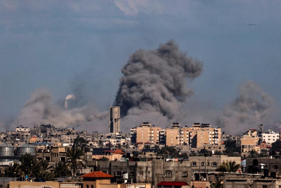 This picture taken from Rafah, in the southern Gaza Strip, shows smoke rising over buildings in Khan Yunis during Israeli bombardment on Feb. 1, 2024, as fighting continues between Israel and the Palestinian Hamas group in Gaza.