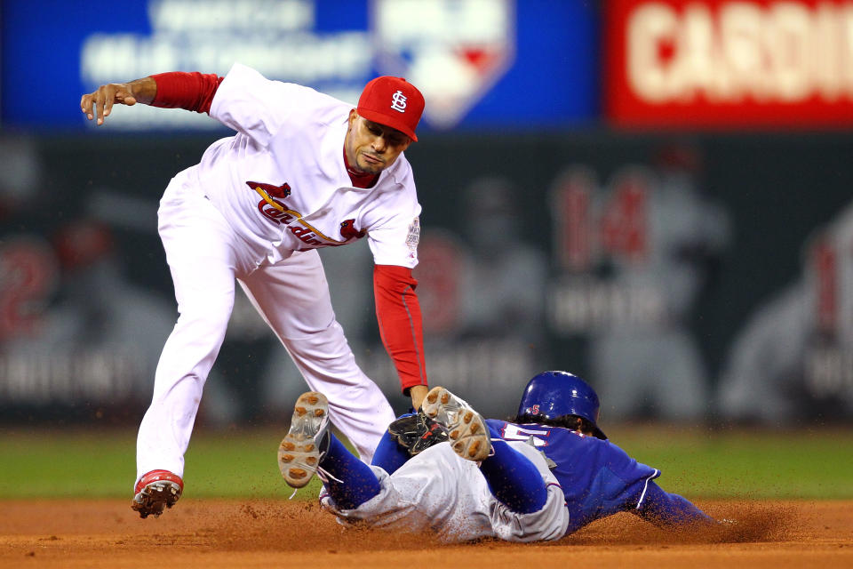 ST LOUIS, MO - OCTOBER 19: Rafael Furcal #15 of the St. Louis Cardinals tags out Ian Kinsler #5 of the Texas Rangers at second base during Game One of the MLB World Series at Busch Stadium on October 19, 2011 in St Louis, Missouri. (Photo by Dilip Vishwanat/Getty Images)