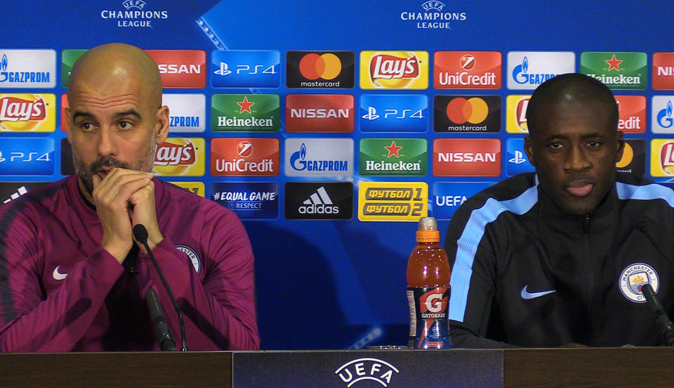 Manchester City manager Pep Guardiola (left) and Yaya Toure during a press conference at the Metalist Stadium, Kharkiv.