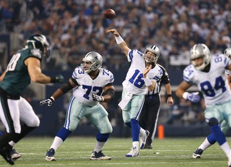 Dec 29, 2013; Arlington, TX, USA; Dallas Cowboys quarterback Kyle Orton (18) throws in the pocket against the Philadelphia Eagles at AT&T Stadium. Mandatory Credit: Matthew Emmons-USA TODAY Sports