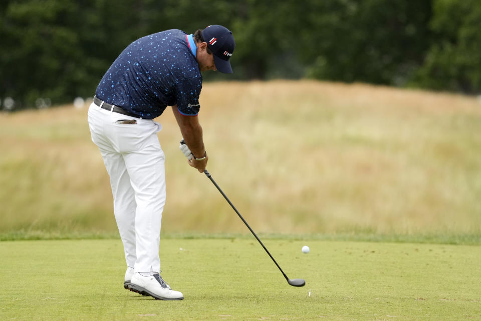 Patrick Reed hits on the 13th hole during the first round of the U.S. Open golf tournament at The Country Club, Thursday, June 16, 2022, in Brookline, Mass. (AP Photo/Charlie Riedel)