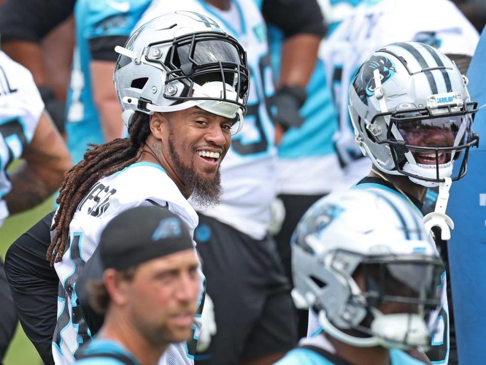 Carolina Panthers linebacker Shaq Thompson, left, stands along a sideline with his teammates during the team’s OTA practice on Tuesday, June 4, 2024.
