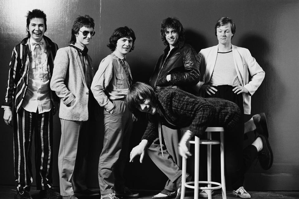 The Boomtown Rats (pianist Johnny Fingers, bassist Pete Briquette, guitarist Garry Roberts, singer Bob Geldof, drummer Simon Crowe and guitarist Gerry Cott), Irish punk band, pose in a group studio portrait, in February 1979. (Photo by Fin Costello/Redferns/Getty Images)