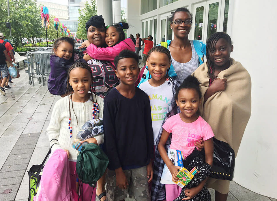 Nina Robinson, top right, lost her home and brought six kids to the shelter at George R. Brown Convention Center in Houston. (Photo: Andy Campbell/HuffPost)