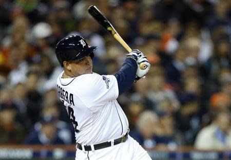 Detroit Tigers third baseman Miguel Cabrera (24) hits an RBI single against the Boston Red Sox during the fourth inning in game four of the American League Championship Series baseball game at Comerica Park. Mandatory Credit: Rick Osentoski-USA TODAY Sports