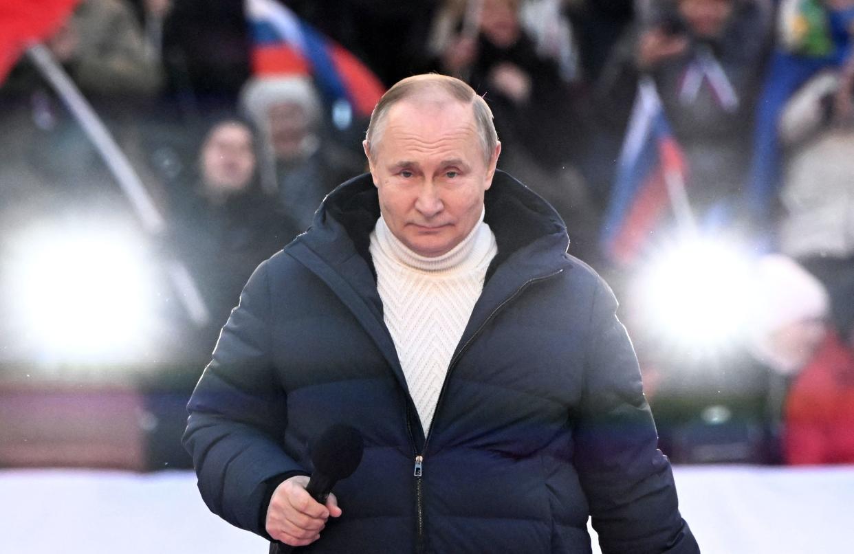 Russian President Vladimir Putin attends a concert marking the eighth anniversary of Russia's annexation of Crimea at the Luzhniki stadium in Moscow on March 18, 2022. (Photo by Sergei GUNEYEV / POOL / AFP) (Photo by SERGEI GUNEYEV/POOL/AFP via Getty Images)