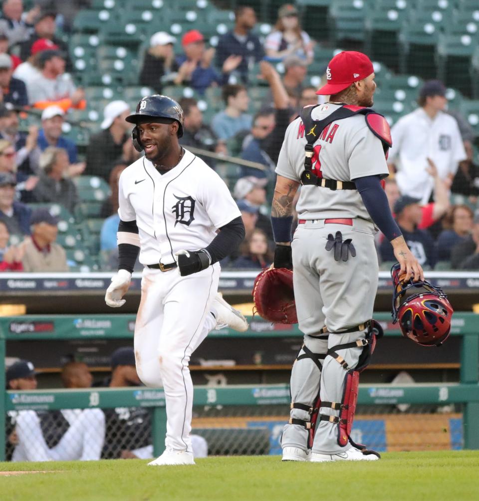 Detroit Tigers center fielder Akil Baddoo (60) scores against the St. Louis Cardinals during fourth inning action  on Tuesday, June 22, 2021, at Comerica Park in Detroit.