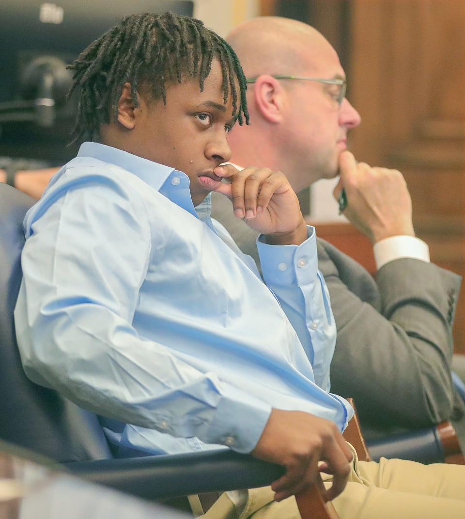 Cameron Jones, left, listens to testimony with his defense attorney Erik Jones during his trial Tuesday before Judge Joy Malek Oldfield for his role in the shooting death of Damarcus Hartwell.