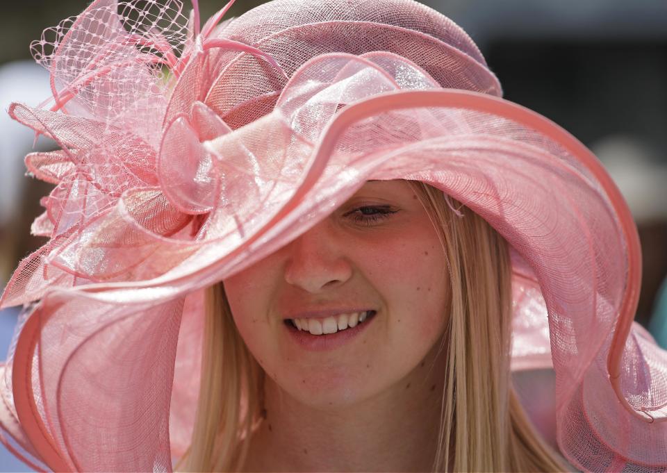 Megan Iteen smiles before the 140th running of the Kentucky Derby horse race at Churchill Downs Saturday, May 3, 2014, in Louisville, Ky. (AP Photo/David J. Phillip)