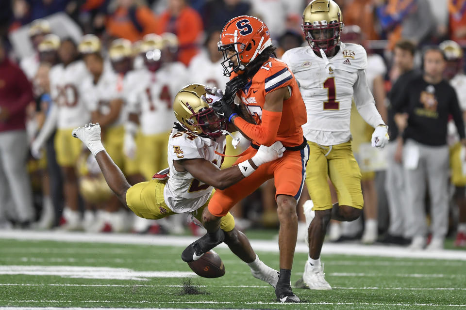 Boston College cornerback Amari Jackson, left, breaks up a pass intended for Syracuse wide receiver Umari Hatcher during the second half of an NCAA college football game in Syracuse, N.Y., Friday, Nov. 3, 2023. (AP Photo/Adrian Kraus)