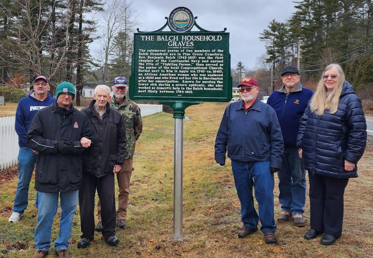 Leaders gather in Barrington for a highway marker dedication honoring the gravesites of two people in Barrington, including an African American woman who was enslaved as a child and who nursed the town's sick residents during a severe epidemic. Left to right are Rick Walker, Barrington fire chief; Scott Littlefield, pastor of First Congregational Church of Barrington; Joel Sherburne, Barrington Historical Society; Bruce Trefethen, American Legion Post 114; and Bruce Decker, Richard Menzel and Holly Decker of FCCB.