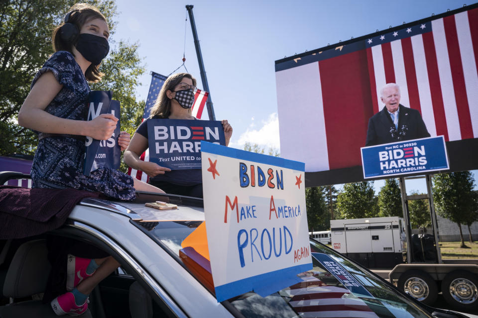 DURHAM, NC - OCTOBER 18: Supporters listen in their cars as Democratic presidential nominee Joe Biden speaks during a drive-in campaign rally at Riverside High School on October 18, 2020 in Durham, North Carolina. Biden is campaigning on Sunday in the battleground state that President Donald Trump won in 2016. (Photo by Drew Angerer/Getty Images)