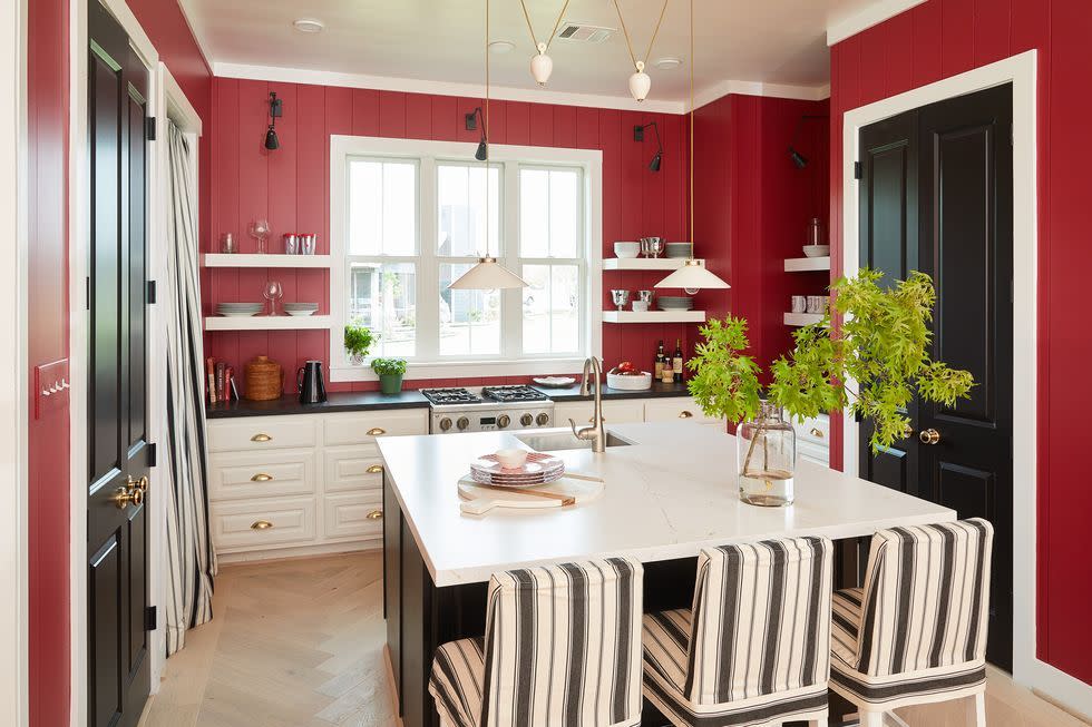 a kitchen with a table and chairs