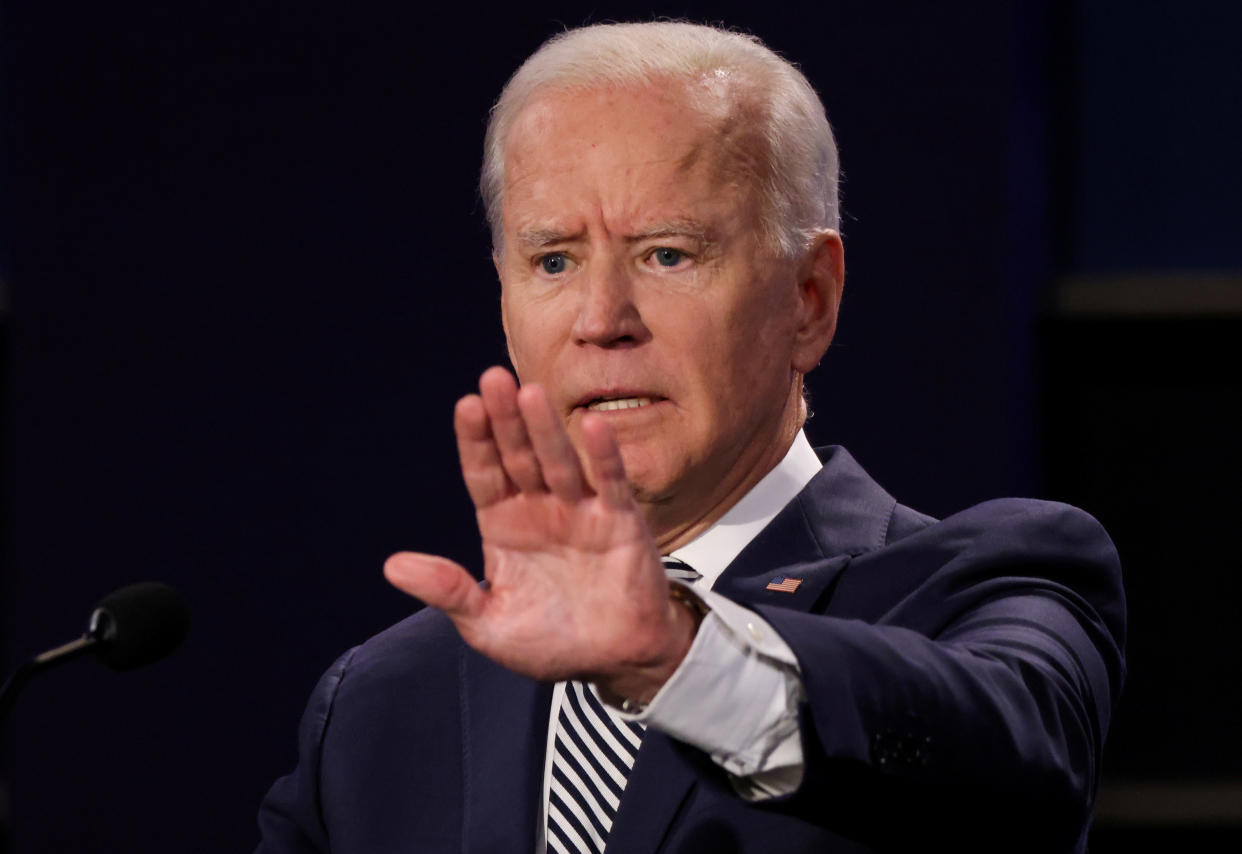 Joe Biden participates in the first 2020 presidential campaign debate with U.S. President Donald Trump held on the campus of the Cleveland Clinic at Case Western Reserve University in Cleveland, Ohio, U.S., September 29, 2020. REUTERS/Jonathan Ernst