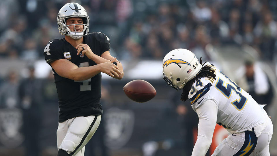 Derek Carr throws the ball away on fourth down. Pic: Getty