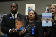 Todd and Mia Minor, both of Accokeek, Md., left, hold a photo of their son, Matthew Minor as they attend a Senate Judiciary Committee hearing with the heads of social media platforms on Capitol Hill in Washington, Wednesday, Jan. 31, 2024, on child safety. The Minor's son, Matthew Minor, died after a TikTok "choking challenge" in 2019. (AP Photo/Susan Walsh)