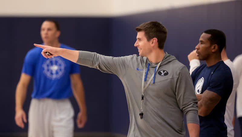 Assistant coach Cody Fueger works with players during BYU basketball practice at the Marriott Center Annex Court in Provo on Tuesday, Oct. 3, 2023.