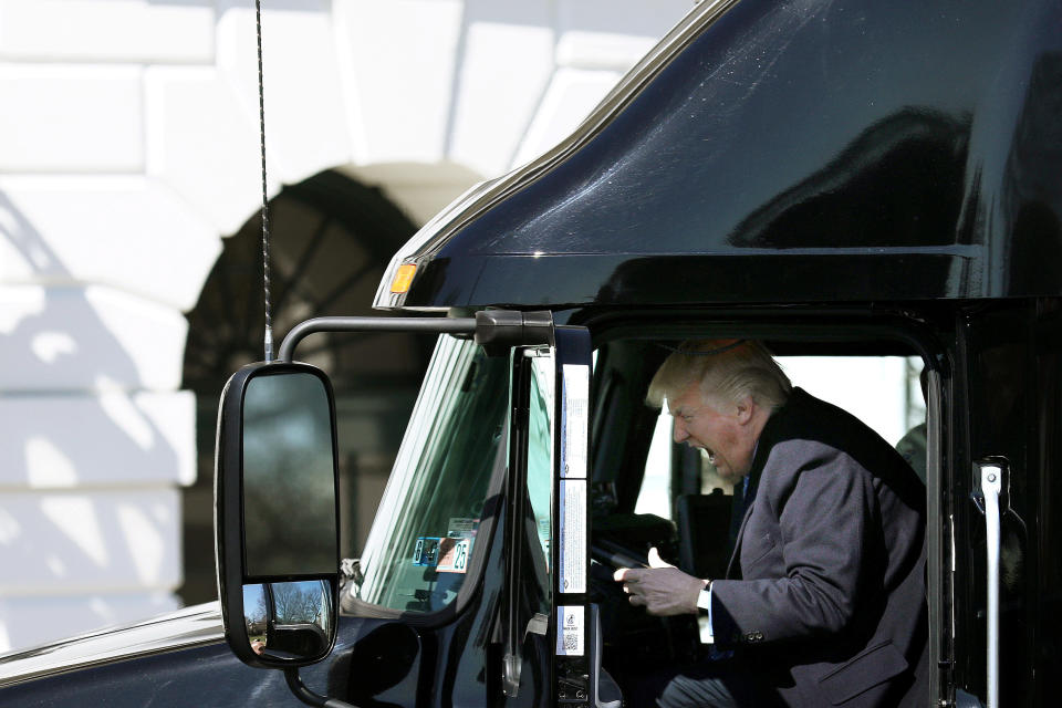 Trump reacts as he sits&nbsp;in a truck on March 23 while&nbsp;welcoming truckers and CEOs to attend a meeting at the White House regarding health care.