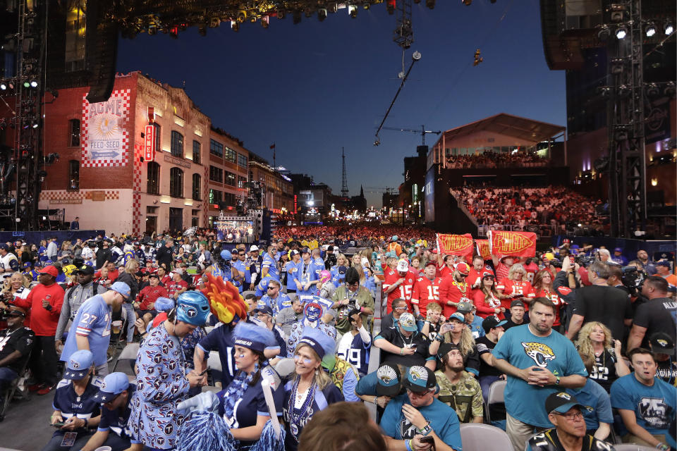 Fans sit on the main stage during the second round of the NFL football draft, Friday, April 26, 2019, in Nashville, Tenn. (AP Photo/Mark Humphrey)
