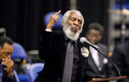 FILE PHOTO - Activist Dick Gregory delivers a speech during a public viewing and funeral for legendary singer James Brown in Augusta, Georgia December 30, 2006. REUTERS/Lucas Jackson/File Photo