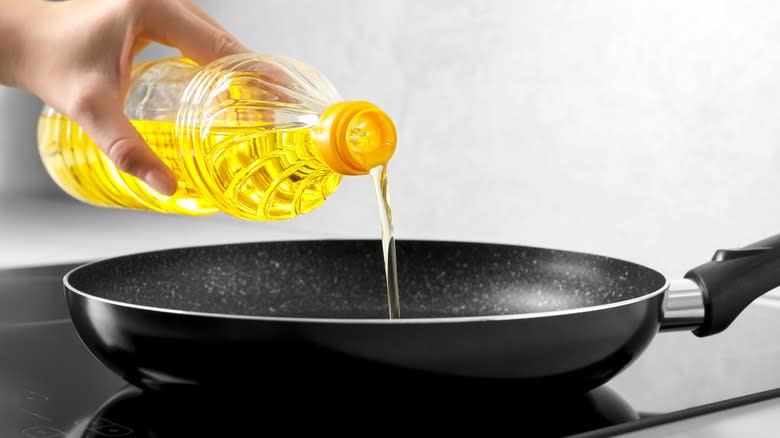 Pouring oil into pan