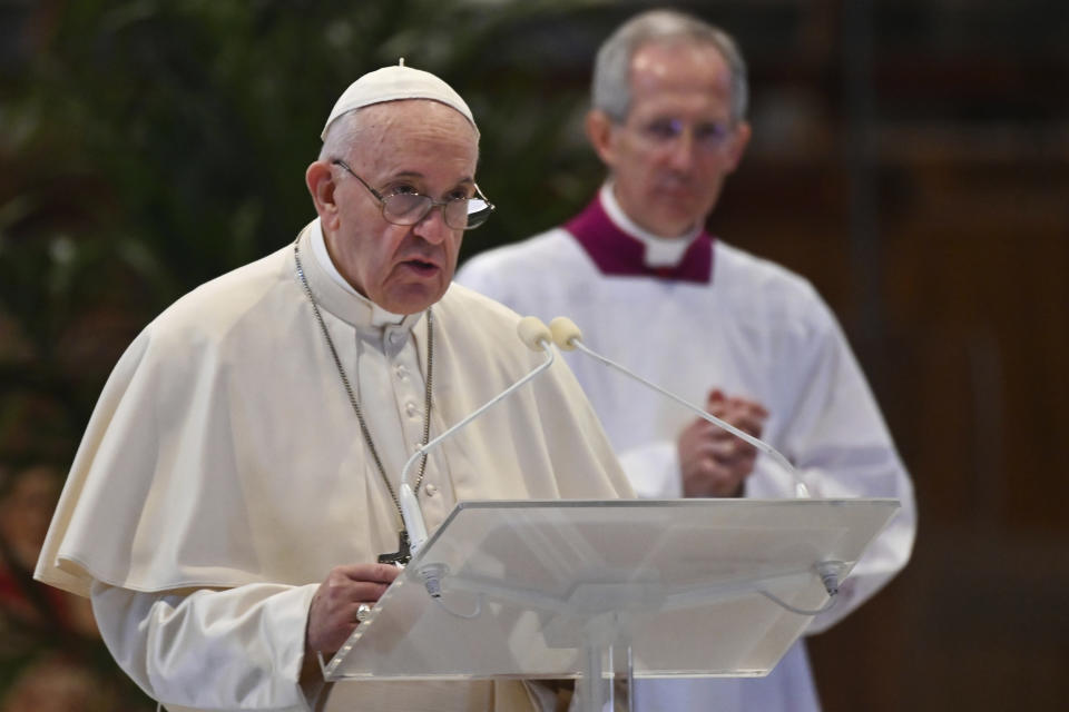 Pope Francis delivers his message during Easter Sunday Mass inside an empty St. Peter's Basilica, at the Vatican, Sunday, April 12, 2020. Pope Francis and Christians around the world marked a solitary Easter Sunday, forced to celebrate the most joyful day in the liturgical calendar amid the sorrowful reminders of the devastation wrought by the coronavirus pandemic. The new coronavirus causes mild or moderate symptoms for most people, but for some, especially older adults and people with existing health problems, it can cause more severe illness or death. (Andreas Solaro/Pool Photo via AP)