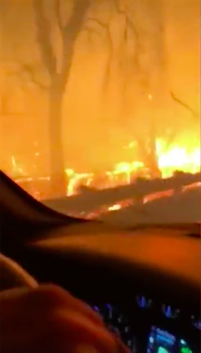 The father can be heard singing to his daughter as they drive through the terrifying blaze. Source: Whitney Allen/ Facebook