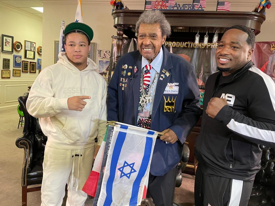 Boxing promoter Don King (center) poses with fighters Antonio Williams (left) and Adrien Broner inside his offices in Deerfield Beach, Fla.