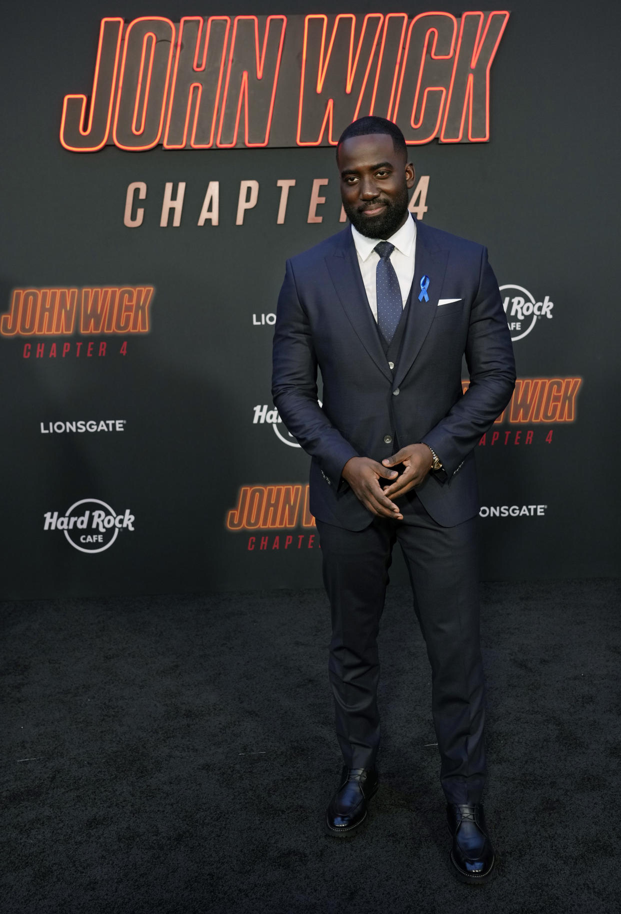 Shamier Anderson, a cast member in "John Wick: Chapter 4," poses at the premiere of the film, Monday, March 20, 2023, at the TCL Chinese Theatre in Los Angeles. (AP Photo/Chris Pizzello)