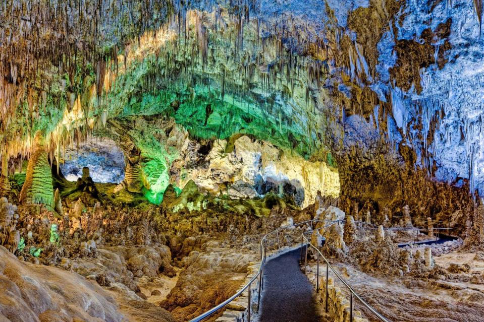 <p><a href="https://www.nps.gov/cave/index.htm" rel="nofollow noopener" target="_blank" data-ylk="slk:Carlsbad Caverns National Park;elm:context_link;itc:0;sec:content-canvas" class="link ">Carlsbad Caverns National Park</a> is underground with more than 119 known caves that were formed from limestone and sulfuric acid. Visitors can hike down or use the option of taking an elevator 750 feet below ground. </p><p>If you’re looking for the full experience, skip the hotel and check out a campground instead. Bring along a <a href="https://www.bestproducts.com/tech/gadgets/g3416/best-portable-mini-small-projectors/" rel="nofollow noopener" target="_blank" data-ylk="slk:portable projector;elm:context_link;itc:0;sec:content-canvas" class="link ">portable projector</a> for an outdoor movie night on the grounds. </p>