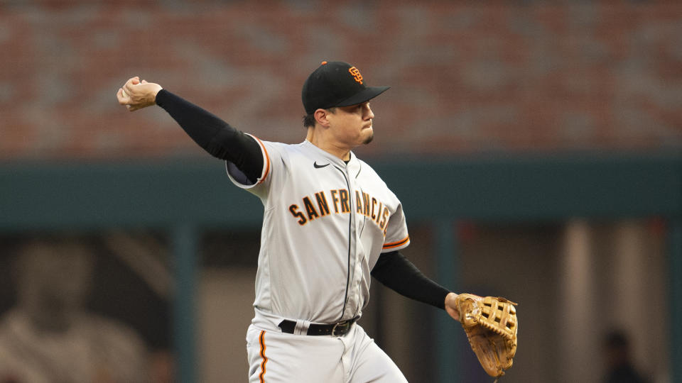 San Francisco Giants second baseman Wilmer Flores throws to first base in the fifth inning of a baseball game against the Atlanta Braves Wednesday, June 22, 2022, in Atlanta. (AP Photo/Hakim Wright Sr.)