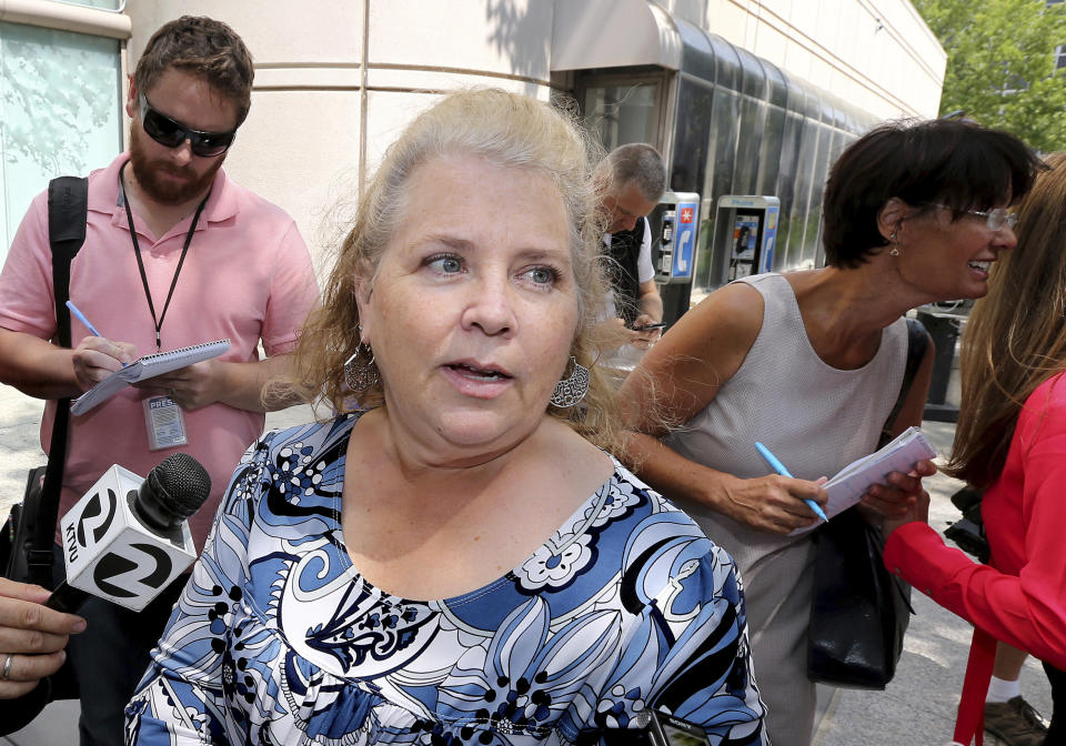 FILE - In this Aug. 23, 2018, file photo Jennifer Carole, the daughter of Lyman Smith, believed to be one of the victims of the Golden State Killer, talks with reporters after Joseph James DeAngelo's court appearance in Sacramento, Calif. Forty years after a sadistic suburban rapist terrorized California in what investigators only later realized were a series of linked assaults and slayings, the 74-year-old former police officer is tentatively set to plead guilty Monday, June 29,2020, to being the elusive Golden State Killer. (AP Photo/Rich Pedroncelli, File)