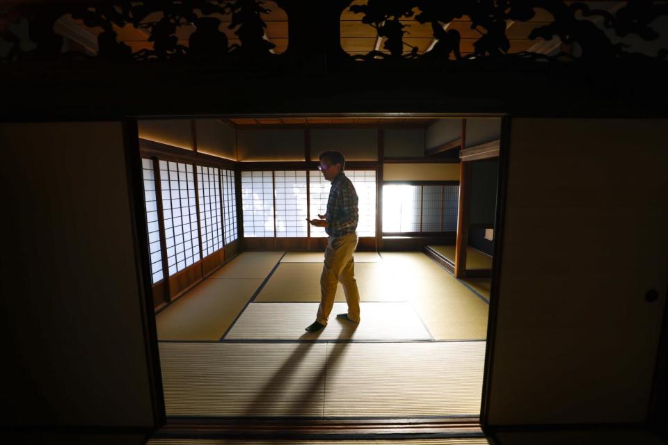 Robert Hori paces in the shōya's largest room, reserved for dignitaries. The walls slide open to reveal the garden.