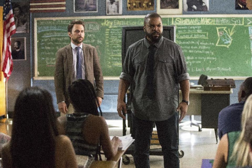 This image released by Warner Bros. Pictures shows Ice Cube, right, and Charlie Day in a scene from "Fist Fight." (Bob Mahoney/Warner Bros. Pictures via AP)