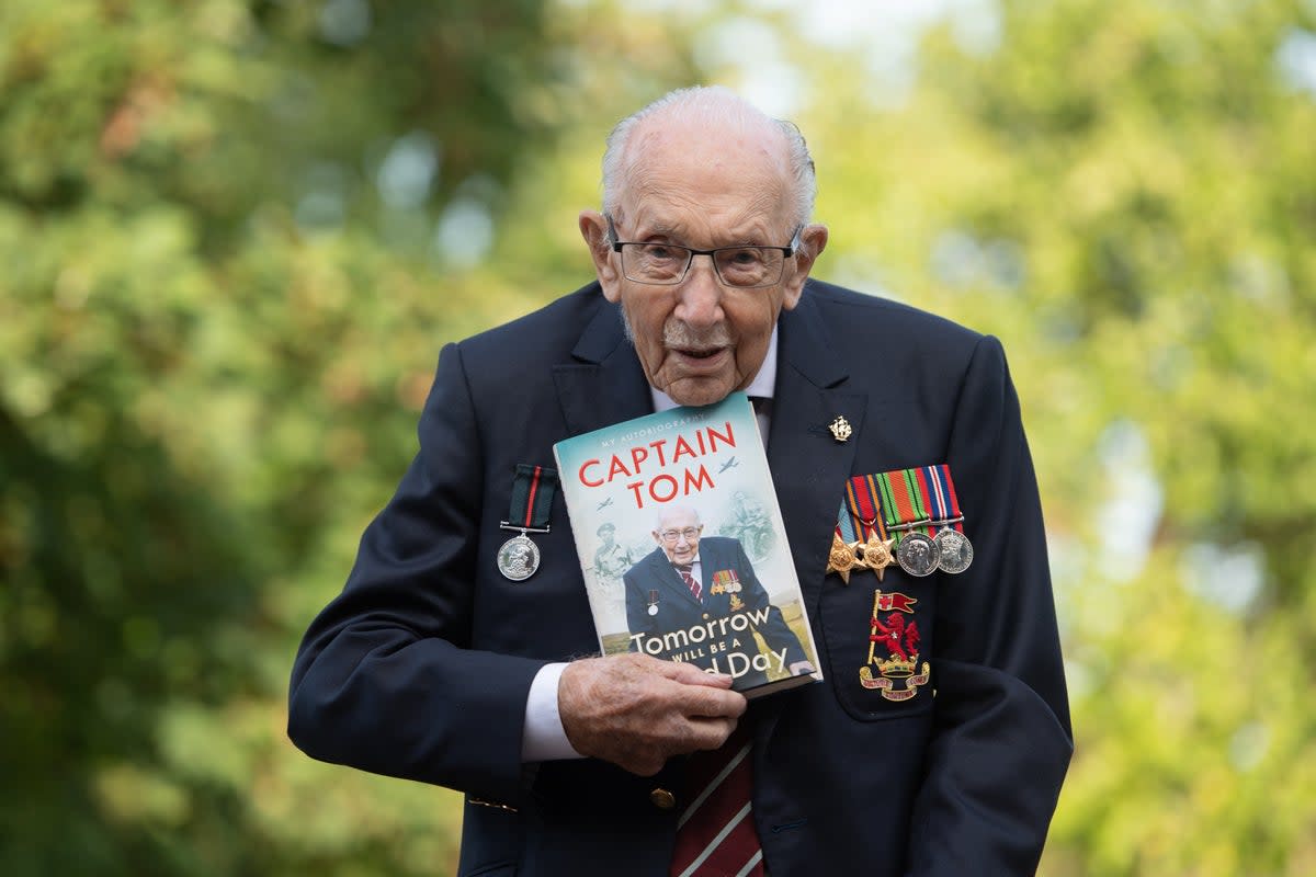 Sir Captain Tom Moore with his autobiography Tomorrow Will Be A Good Day, published in September 2020  (PA)
