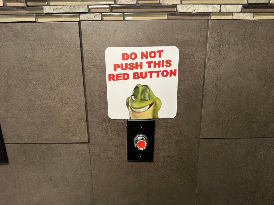 "Do not push this red button" tempts customers into hitting the party switch in bathrooms at six Hop Shops locations.