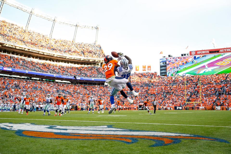 Dez Bryant tangles with cornerback Bradley Roby in a September game last season. (Getty Images) 