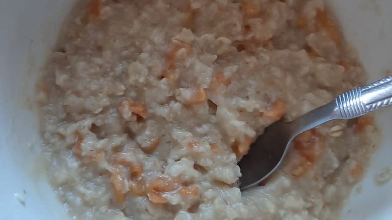 Closeup of peaches and cream instant oatmeal with spoon