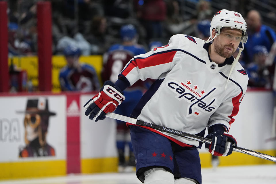 FILE - Washington Capitals center Evgeny Kuznetsov (92) skates in the second period of an NHL hockey game, Wednesday, Jan. 24, 2024, in Denver. Kuznetsov was cleared on Saturday, March 2, to resume practicing -- but not yet playing -- in entering the follow-up care phase of the NHL/NHLPA player assistance program. (AP Photo/David Zalubowski, File)