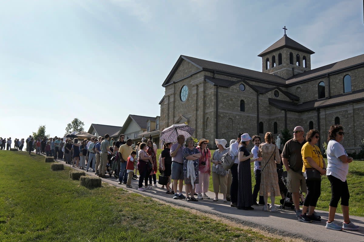 People wait to view the body of Sister Wilhelmina Lancaster at the Benedictines of Mary, Queen of Apostles abbey Sunday, May 28, 2023, near Gower, Mo.Hundreds of people visited the small town in Missouri this week to see the nun's body that has barely decomposed since 2019 â€” some are saying it's a sign of holiness in Catholicism, while others are saying the lack of decomposition may not be as rare as people think.  (AP Photo/Charlie Riedel) (AP)