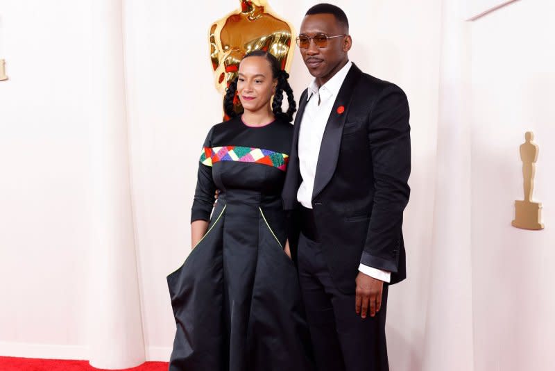 Mahershala Ali, seen here with Amatus Sami-Karim, wore a red pin to the Oscars on Sunday. Photo by John Angelillo/UPI