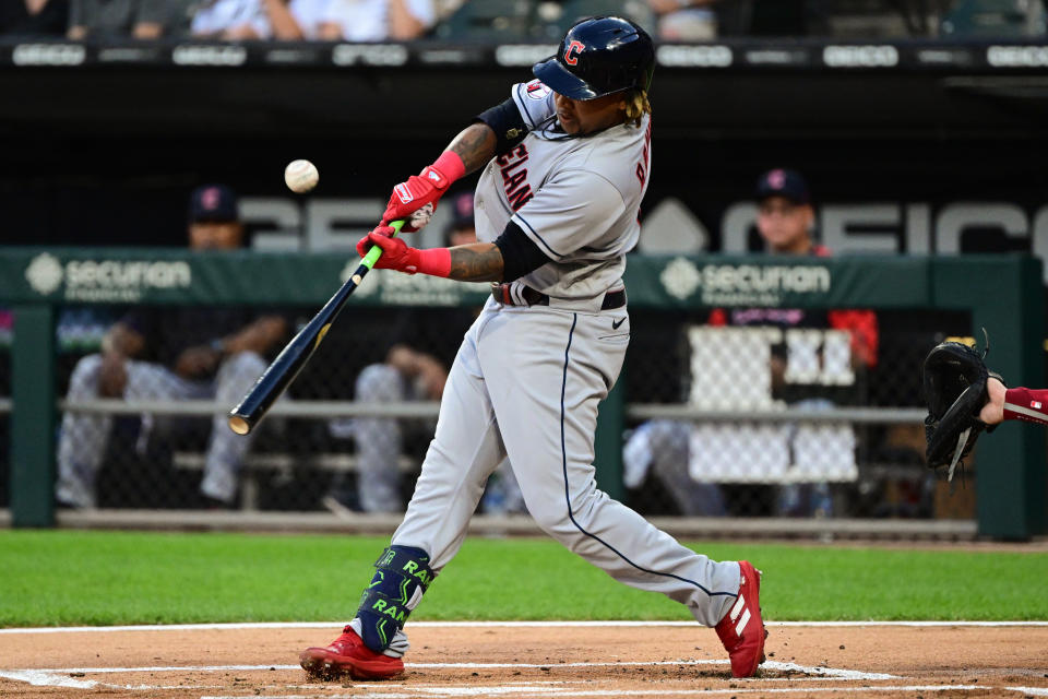 Jose Ramirez #11 of the Cleveland Guardians hits a double in the first inning of an MLB game against the Chicago White Sox