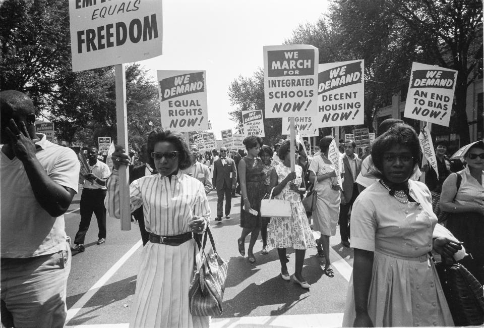 People carrying signs for equal rights, integrated schools, decent housing, and an end to bias during the March on Washington on Aug. 28, 1963. (Warren K. Leffler / Library of Congress)