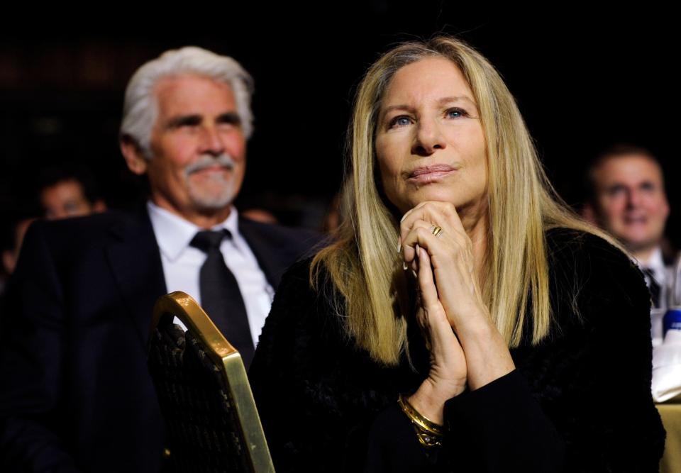 Barbra Streisand listens to President Obama speak at the USC Shoah Foundation's 20th anniversary Ambassadors for Humanity gala in Los Angeles. Streisand's husband, James Brolin, sits at left. Streisand appealed to U.S. lawmakers for more funding and research devoted to women and heart disease, calling it the No. 1 killer of women even as most research into the disease focuses on men.
