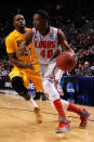 PORTLAND, OR - MARCH 15: Demetrius Walker #40 of the New Mexico Lobos drives on Larry Anderson #21 of the Long Beach State 49ers in the first half in the second round of the 2012 NCAA men's basketball tournament at Rose Garden Arena on March 15, 2012 in Portland, Oregon. (Photo by Jonathan Ferrey/Getty Images)