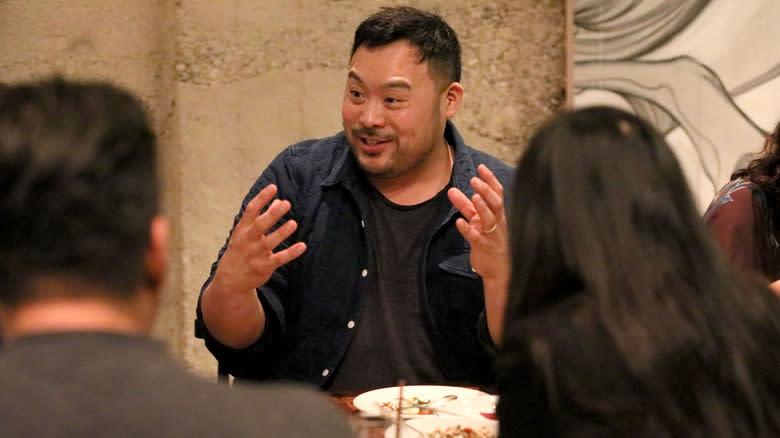 David Chang Gesturing at Table