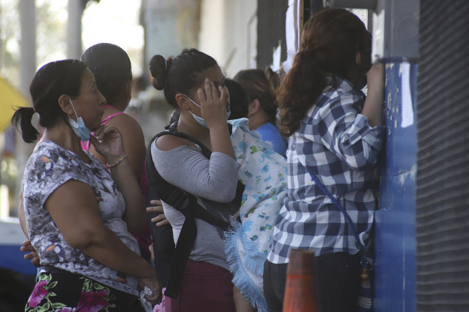 FILE - Relatives of persons who have been arrested by the police wait outside El Penalito temporary prison asking for information about their loved ones in Ciudad Delgado, El Salvador, Wednesday, April 6, 2022. During a virtual hearing in July 2023 with the Inter-American Commission on Human Rights, El Salvador’s Presidential Commissioner for Human Rights and Freedom of Expression Andrés Guzmán denied torture or violations of freedom of expression. (AP Photo/Salvador Melendez, File)