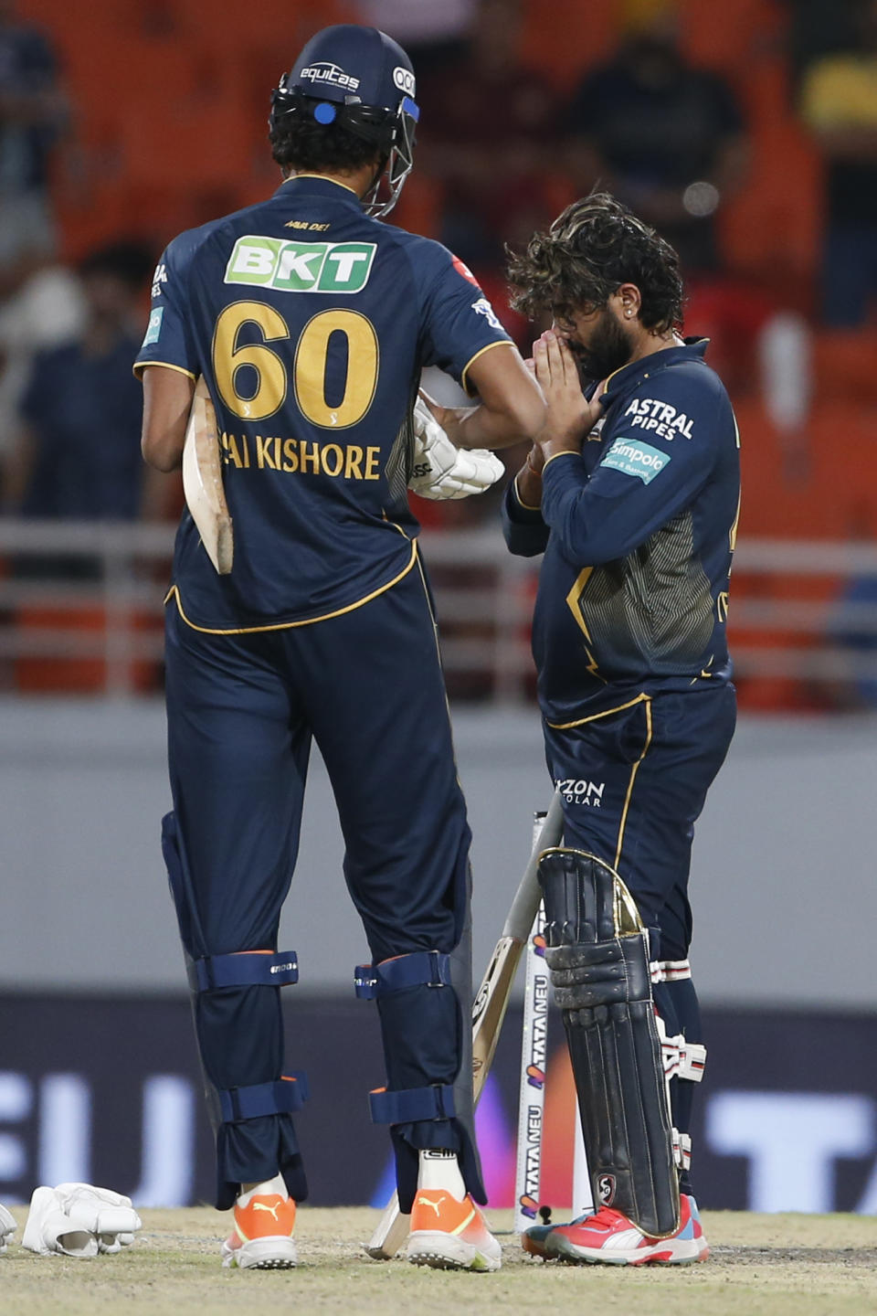 Gujarat Titans' Rahul Tewatia , right, and his batting partner Sai Kishore celebrate their team's win over Punjab Kings in the Indian Premier League cricket match between Punjab Kings' and Gujarat Titans' in Mullanpur, India, Sunday, April 21, 2024.(AP Photo/ Surjeet Yadav))